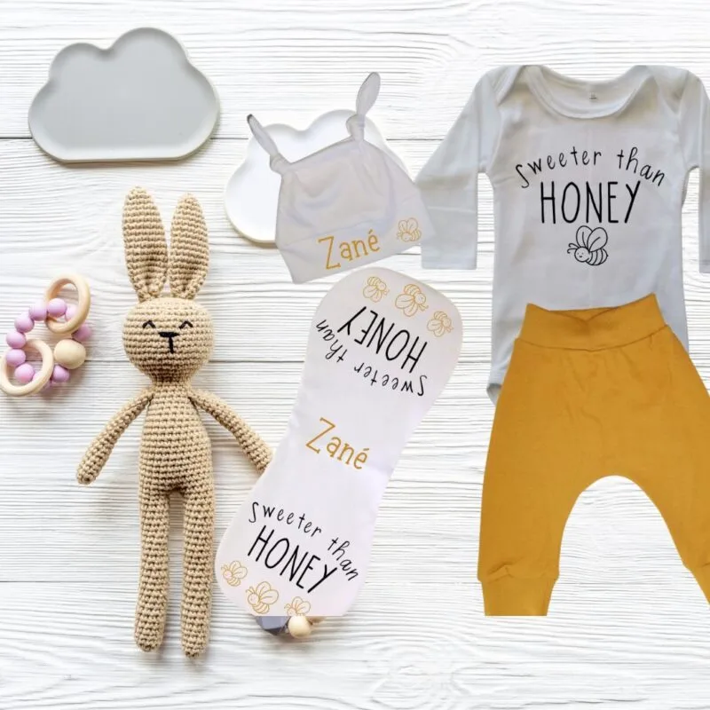 Printed beanie, butterfly burp cloth and long sleeve onesie with harem pants